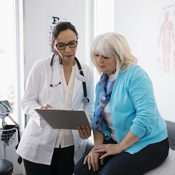 Doctor and patient looking at chart