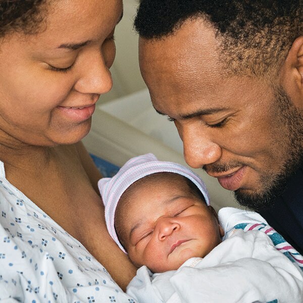 Mother and father with newborn baby
