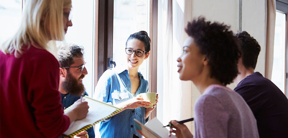 Woman presenting to team