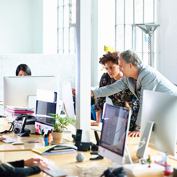 Woman and man looking at a monitor