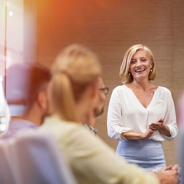 Woman presenting to team