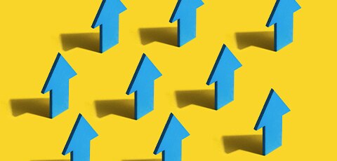 Blue arrows against yellow backdrop