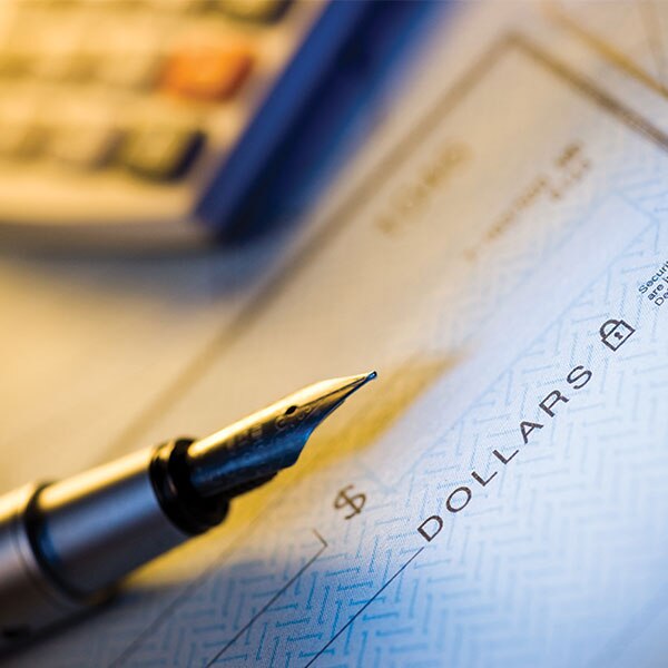 check with pen on top of it