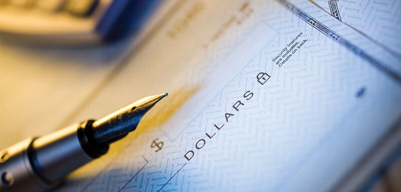 check with pen on top of it