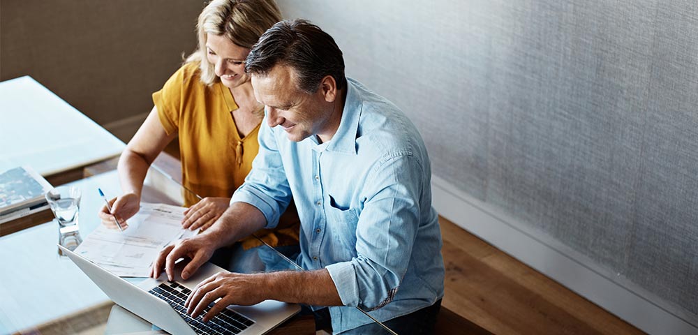 husband and wife at the computer