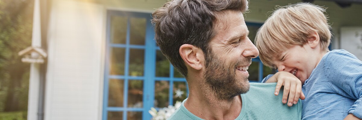 father and son laughing