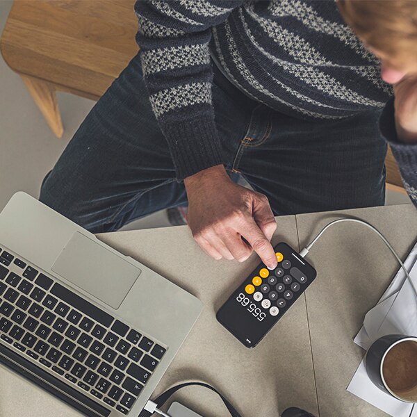 Man working on calculator