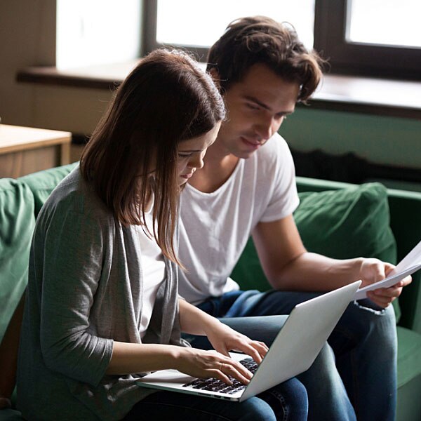 A young couple looking at their finances