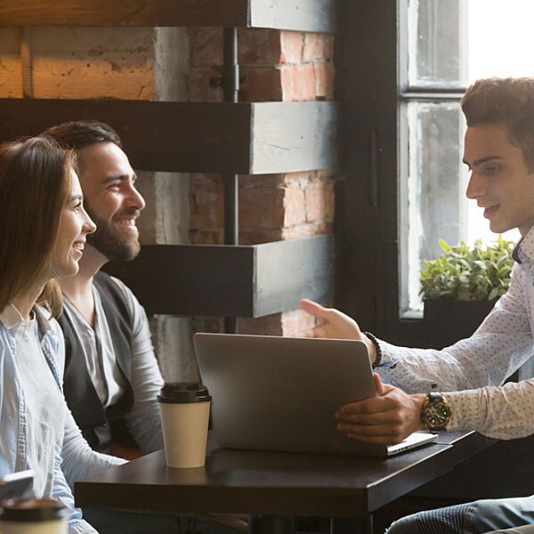 Couple discussing finances with mortgage broker