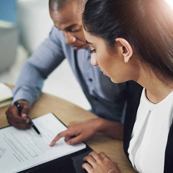 A profession woman and man reviewing a legal document together