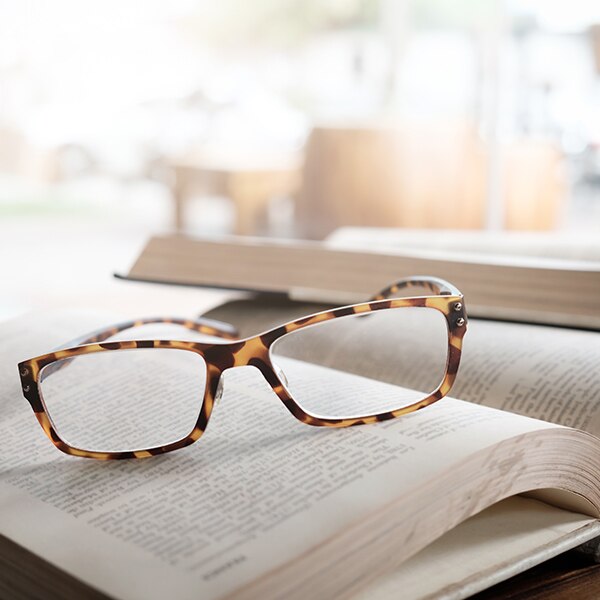 Glasses and financial books