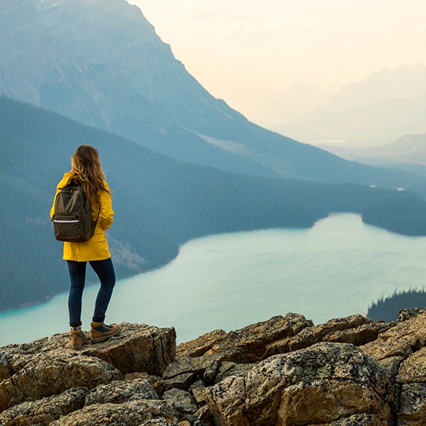 Person standing above a river