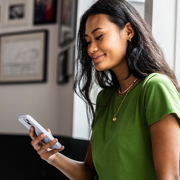 Person smiling at phone