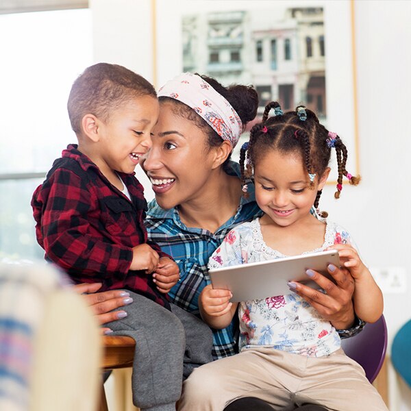 snuggling together using a tablet