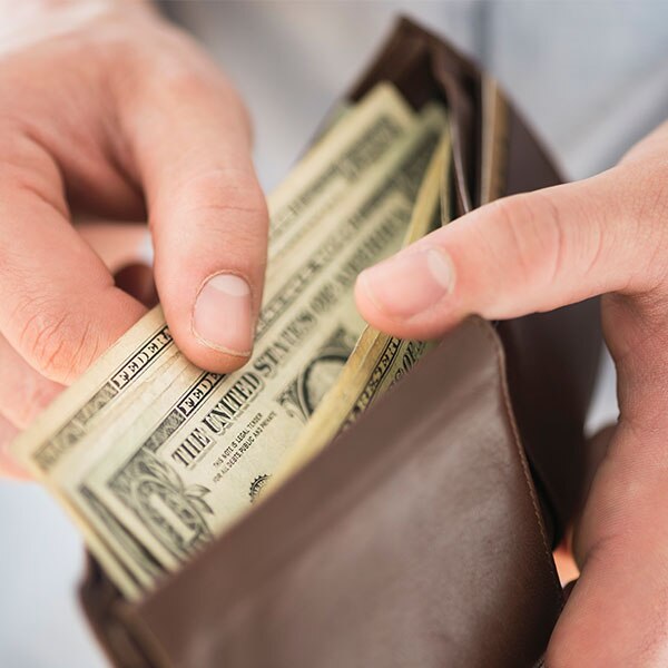 Man pulling money out of his wallet