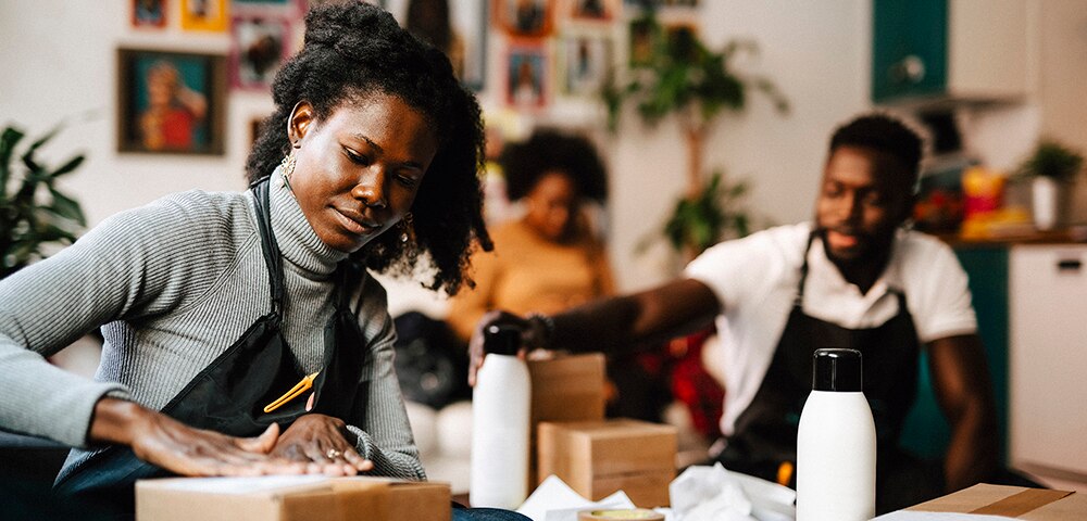 woman closing a package