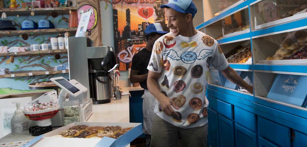 man working in donut shop