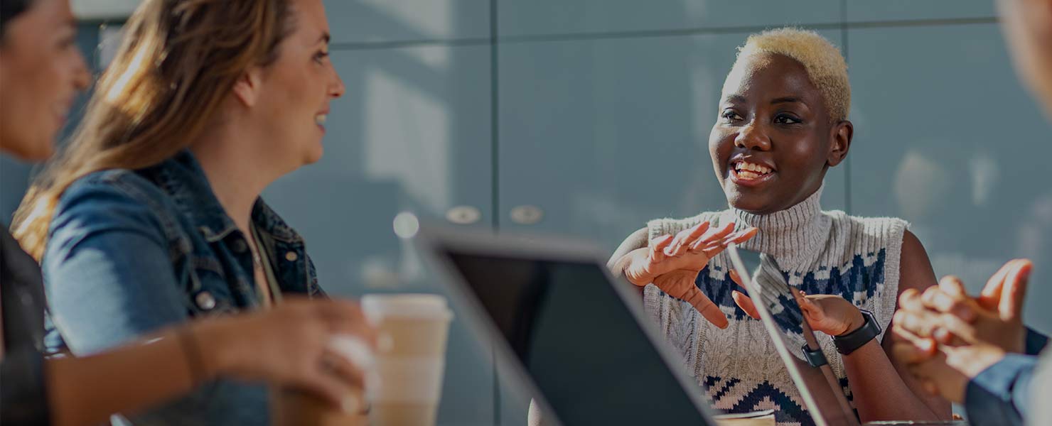Women around meeting room table