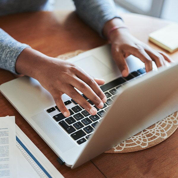 Person typing on laptop