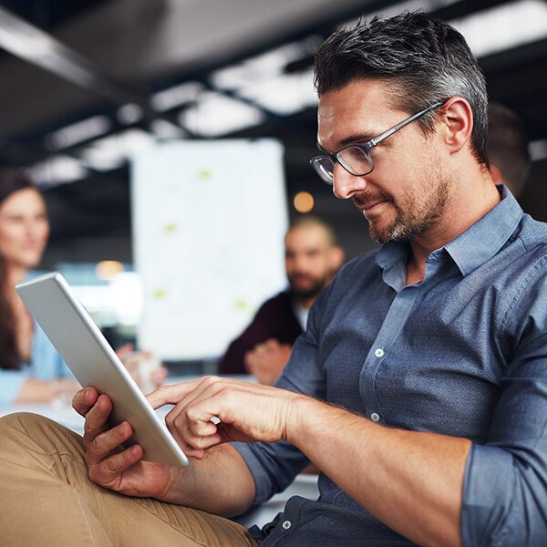 Man looking at tablet