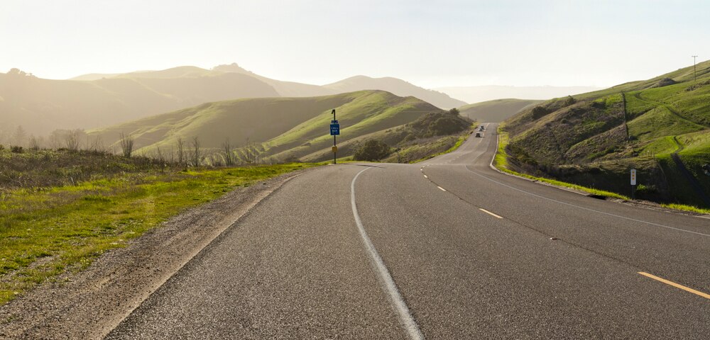 road winding through green mountains