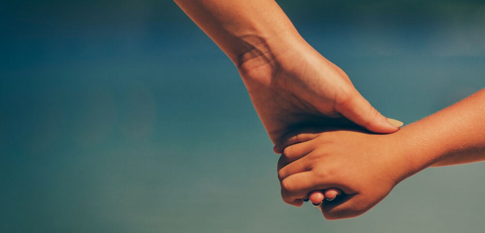 two people holding hands