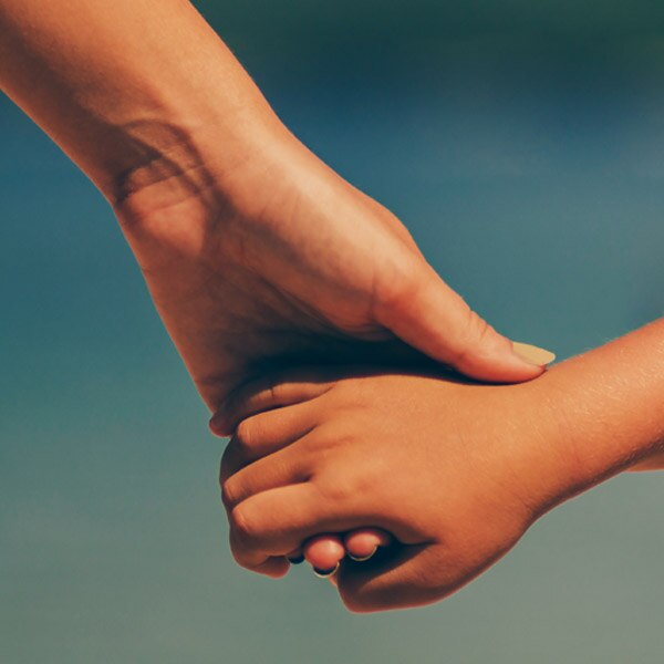 two people holding hands