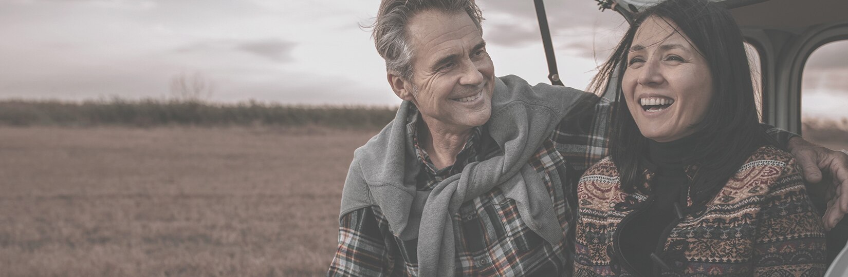 Laughing couple in outdoor setting