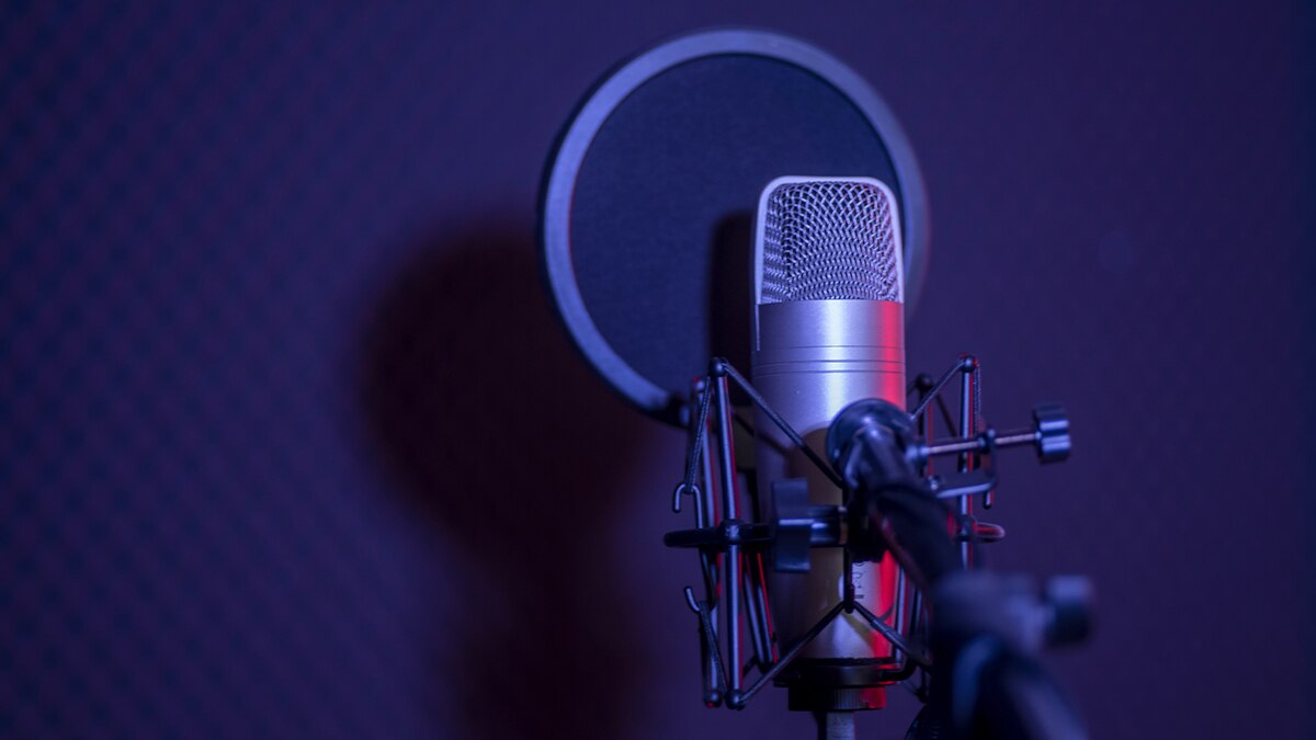 Microphone in front of blue background